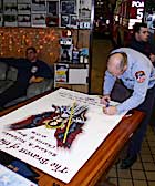 FDNY signs banner for Pittsburg Fire Department
